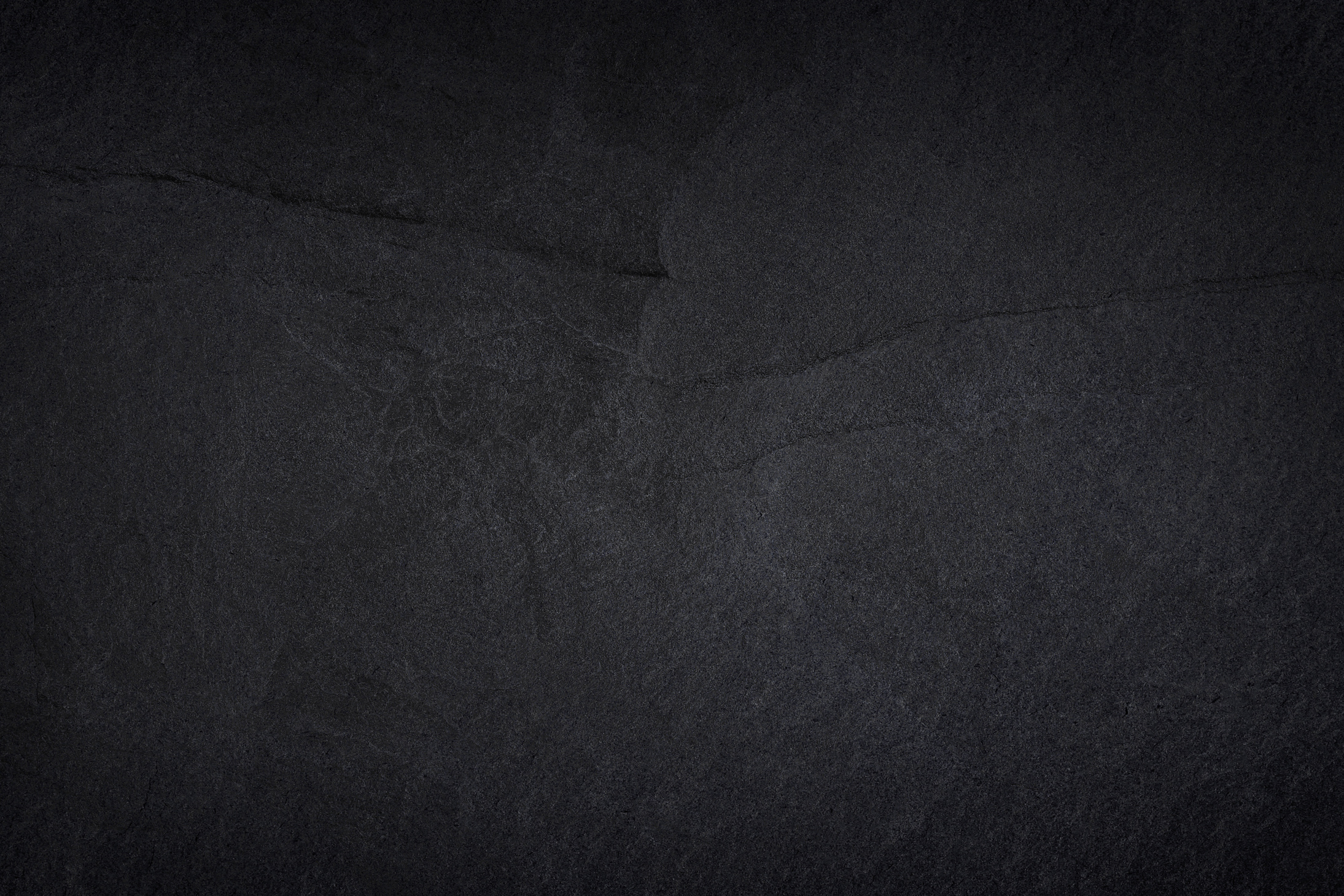 Dark grey black stone for background or natural black slate texture.